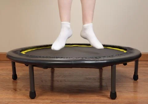Rebounding on small trampoline Stock Photos