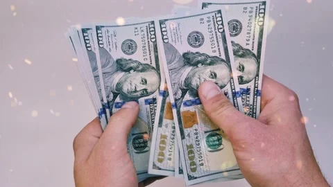 Recalculation of bundle of one hundred dollar bills Stock Footage 165844762