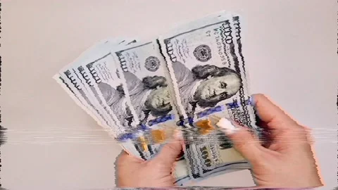 Recalculation of bundle of one hundred dollar bills Stock Footage 165847575