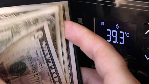 Recalculation money in front of the display on the control panel of an boiler Stock Footage 147676262
