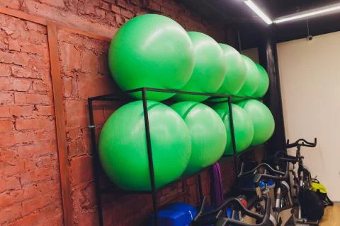 Receding row of weights lined up in a gym waiting for clients with focus to the Stock Photos
