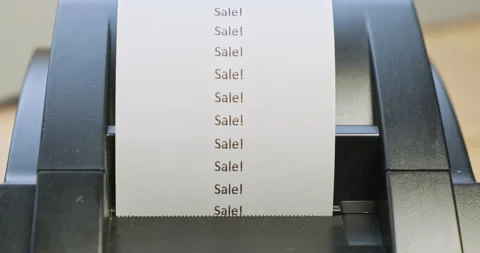 Receipt printer prints text: sale. Close-up, front view. The concept of Stock Footage 213546788