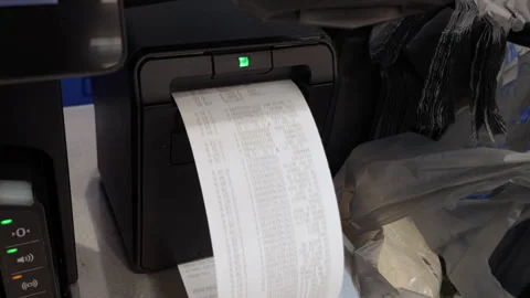 Receipt at self-checkout counter inside Walmart store. Cash register printi.. Stock-Footage 316835803
