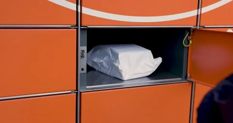 Receive parcel from self service post terminal machine. hand taking out packa Stock Footage 146126277