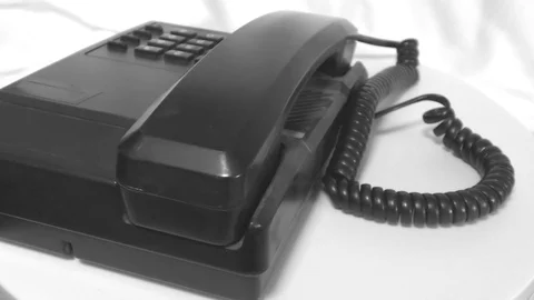 The receiver and phone moving in circular motion on white Stock Footage 111887517