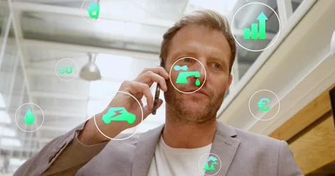 Receiving call, man walking atrium on phone, icons orbiting faucet, car, chart, Stock Footage 331701113