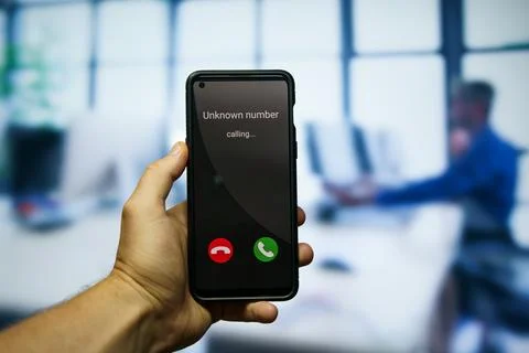 Receiving call from unknown number on mobile phone Stock Photos
