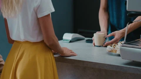 Receiving cup of Latte art Back view of couple with Barista preparing cappuccino Video stock 132864624