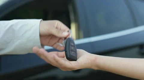 Receiving keys of new status car from dealer  HD Stock Footage 12064370