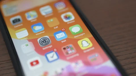 Receiving lots of emails on iPhone [6K30] pressure in home office Stock-Footage 127632983