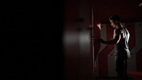 Receiving a message. Handsome nice man looking at his smartphone screen while Stock Photos