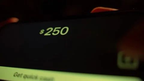 Receiving money through a mobile app close-up. Fictional mobile app Stock Footage 309545094