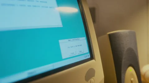 Receiving New Email Notification while Working on Retro Computer Stock Footage 327233589