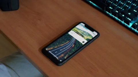 Receiving a notification in the smarthphone and picking it up Stock Footage 140143925