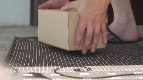 Receiving a package at the front door Stock Footage 332971945