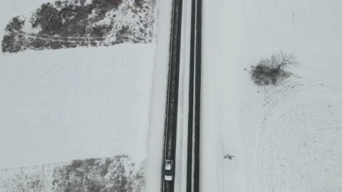 Recently snow plowed highway through western Wisconsin valley Stock Footage 166263643