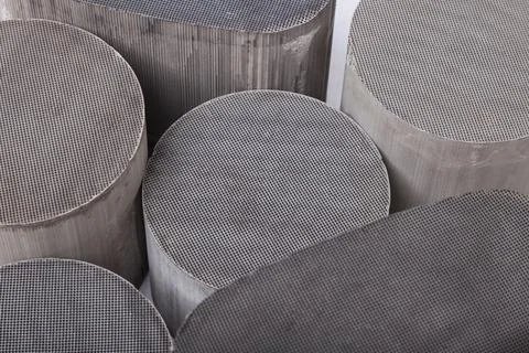 Reception and processing of scrap metal. Close-up on a mesh-shaped ceramic ca Stock Photos