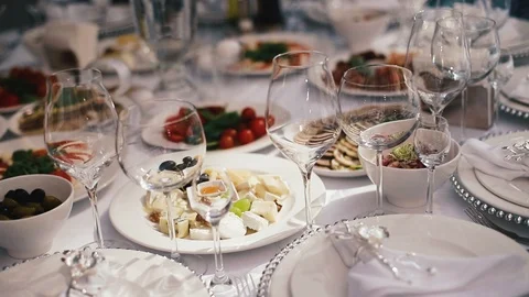 Reception, celebrating in the restaurant. Large round white tables decorated Stock Footage 100596491