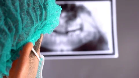 At a reception the dentist. Dentist shows on the tablet x-ray her teeth. Modern Stock Footage 101790752