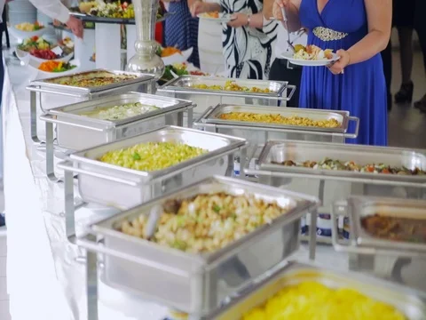 Reception: people impose food in the dish Stock Footage 77979404
