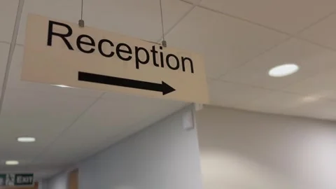 Reception swinging ceiling signage office Video stock 303083091
