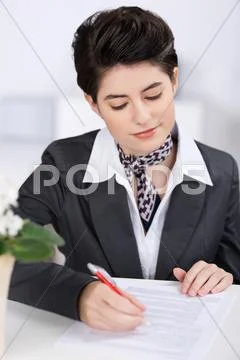 Receptionist completing a form Stock Photos