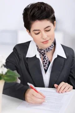 Receptionist completing a form Stock Photos