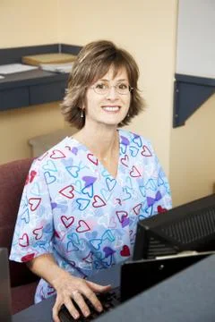 Receptionist in Doctors Office Stock Photos