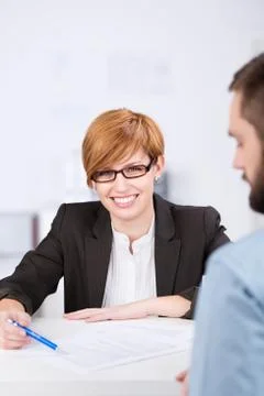 Receptionist explaining document Stock Photos