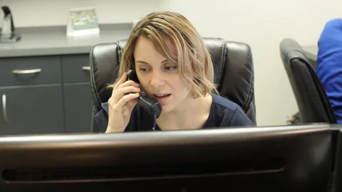 Receptionist On the Phone  Stock Footage 86579738
