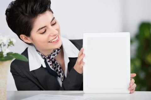 Receptionist showing a blank tablet Stock Photos