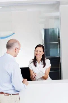 Receptionist showing document Stock Photos