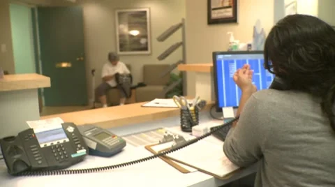 Receptionist taking a call Stock Footage 8569104