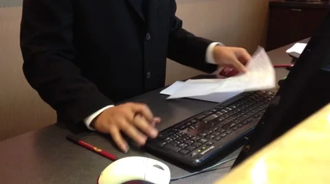 Receptionists making reservation for guest Stock Footage 41477142