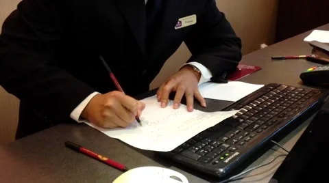 Receptionists making reservation for guest Stock Footage 54719766