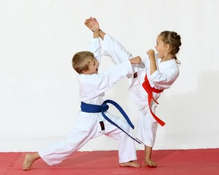 Receptions of self-defence protecting from an attack a girl beats a leg Stock Photos