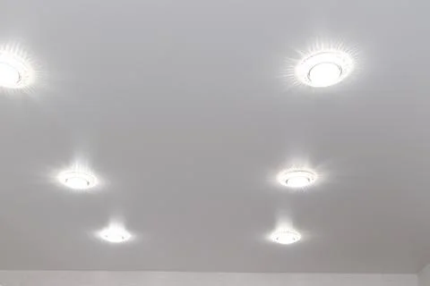 Recessed ceiling lights in a white stretch ceiling Stock Photos
