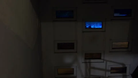 Recessed framed illuminated rectangles form rhythmic grid resembling artistic Stock Footage 328377569