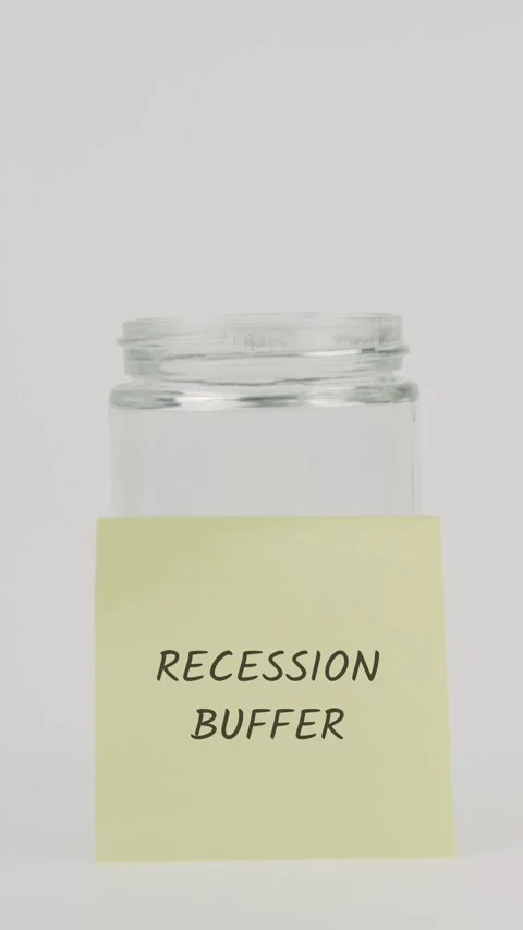Recession buffer text or word on yellow sticky note attached to glass jar Stock Footage 311773647