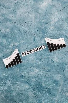 Recession text in between graphs with stats going up then going down, economi 스톡 사진