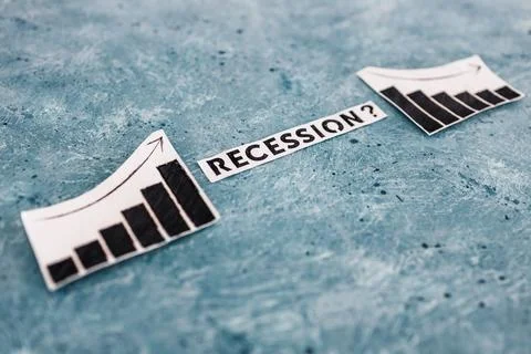 Recession text in between graphs with stats going up then going down, economi 写真素材