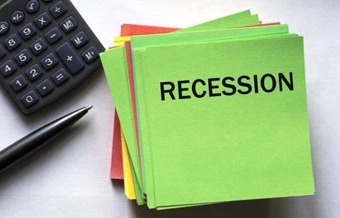 RECESSION - text on a green note sheet against the background of a calculator Stock Photos