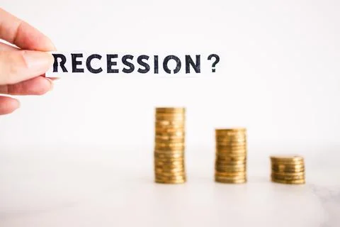 Recession text with question mark in front of decreasing stacks of coins, red 写真素材