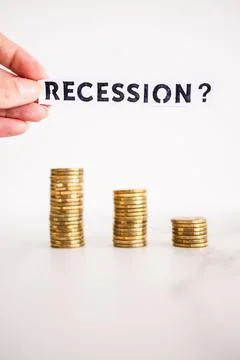 Recession text with question mark in front of decreasing stacks of coins, r.. 写真素材