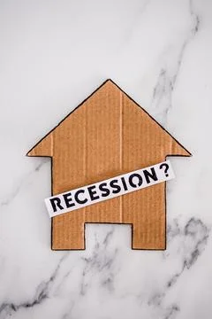 Recession text with question mark over house icon made of cardboard, post pan 스톡 사진
