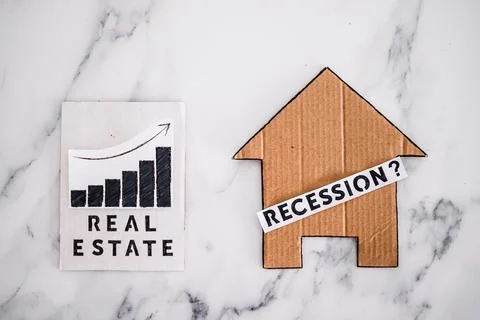 Recession text with question mark over house icon made of cardboard next to r 스톡 사진