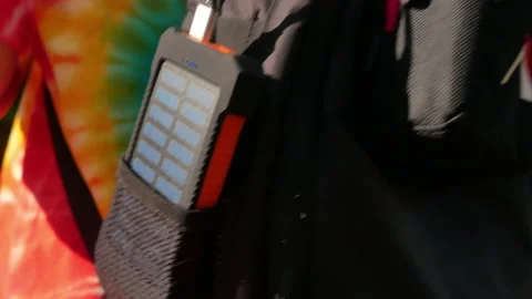 A rechargeable mobile power pack with solar panels in female traveler's backpack Stock Footage 160084749