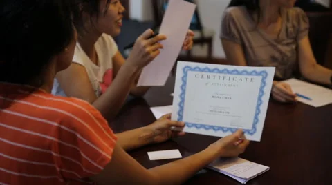 Recieving a certificate of completion graduate Stock Footage