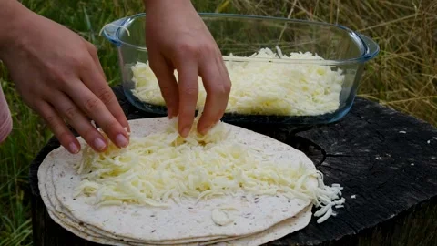 Recipe Fresh Cheese Grated by Hand for Homemade Tortilla with Garden Tomatoes Stock Footage 345169700