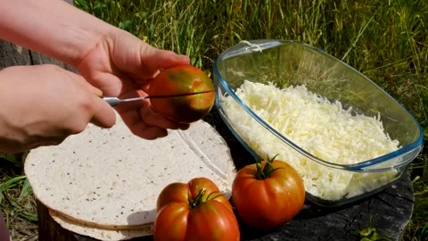 Recipe Fresh Cheese Grated by Hand for Homemade Tortilla with Garden Tomatoes Stock Footage 345169902
